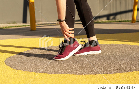 Ankle aching after sport trauma 95354147