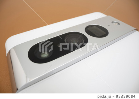 Close-up view of cameras of a phone, shot with macro probe lens Close-up view of cameras of a phone, shot with macro probe lens 95359084