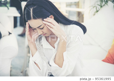 Stress asian women headache have migraine feeling temples stressfull upset depressed. Strong headache migraine exhausted young girl. Office syndrome unhealthy Tension person. Woman headache concept 95361995