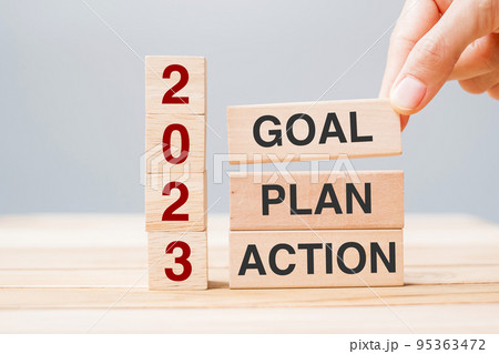 hand holding wooden block with text 2023 GOAL, PLAN and ACTION on table background. Resolution, strategy, solution, goal, business and New Year holiday concepts hand holding wooden block with text 2023 GOAL, PLAN and ACTION on table background. Resolution, strategy, solution, goal, business and New Year holiday concepts 95363472