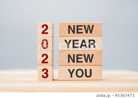 hand holding wooden block with text 2023 NEW YEAR NEW YOU on table background. Resolution, strategy, goal, business and holiday concepts hand holding wooden block with text 2023 NEW YEAR NEW YOU on table background. Resolution, strategy, goal, business and holiday concepts 95363473