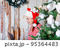 Christmas online shopping. Woman in santa hat. 95364483