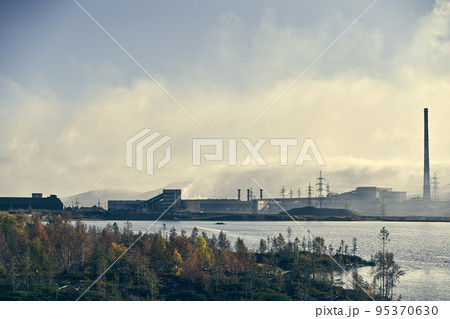 Industrial landscape with heavy pollution produced by a large factory. 95370630
