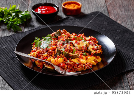 tasty Polenta Ground beef Casserole on black plate tasty Polenta Ground beef Casserole on black plate 95373932