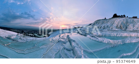 Pamukkale Travertines Cinematic Aerial Drone footage. Turkish famous white thermal bath with healthy clean water in a beautiful sunset. 95374649