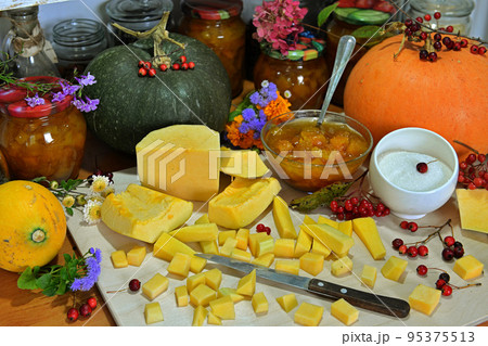Old kitchen still life witch cooking pumpkin jam concept, vintage, thanksgiving and autumn background. Old kitchen still life witch cooking pumpkin jam concept, vintage, thanksgiving and autumn background. 95375513