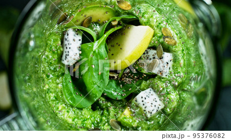 Green fresh smoothie blended in blender, top view. Healthy eating concept. 95376082