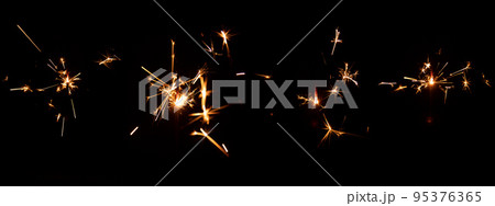 Set of festive sparkler with sparks on black background for overlay blending mode for holiday design projects 95376365