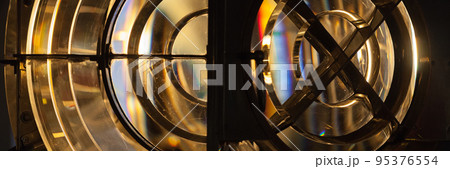 Rotating lighthouse lamp with a Fresnel lenses, panorama 95376554