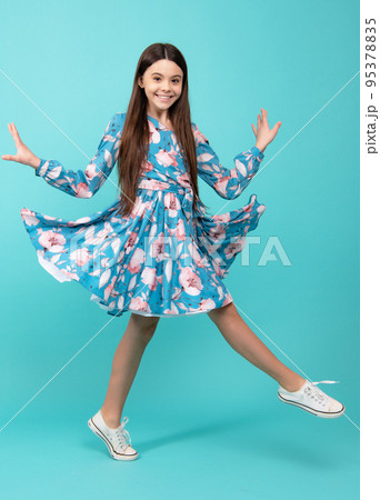 Excited face. Amazed expression, cheerful and glad. Full length little overjoyed teen girl 12, 13, 14 year old jump and run isolated on blue background studio. Excited face. Amazed expression, cheerful and glad. Full length little overjoyed teen girl 12, 13, 14 year old jump and run isolated on blue background studio. 95378835