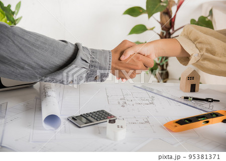 Architect team success and handshaking after meeting consult and work for architectural construction project Architect team success and handshaking after meeting consult and work for architectural construction project 95381371