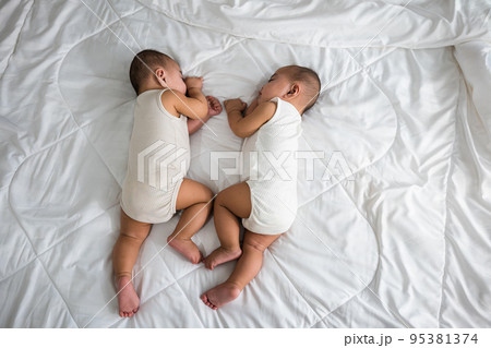 Asian two adorable twin babies boy, Happy childhood 95381374