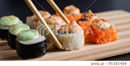 Sushi set on bamboo tray Stock Photo by Rido81