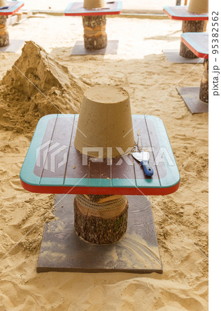 Sand castle made by kids on a craft lesson on beach 95382562