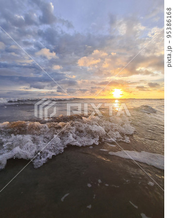 Orange bright color sunset over ocean 95386168