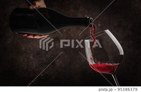 Pouring red wine Pouring red wine 95386379