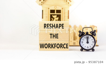 Reshape the workforce and support symbol. Concept words Reshape the workforce on blocks. Black alarm clock. Beautiful white table white background. Business reshape the workforce concept. Copy space Reshape the workforce and support symbol. Concept words Reshape the workforce on blocks. Black alarm clock. Beautiful white table white background. Business reshape the workforce concept. Copy space 95387104