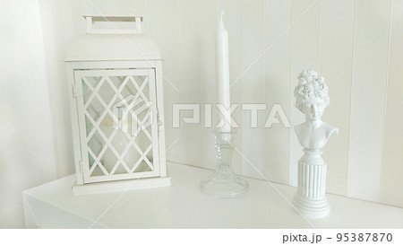 Background image of a candlestick lantern and a silhouette of a woman Background image of a candlestick lantern and a silhouette of a woman 95387870
