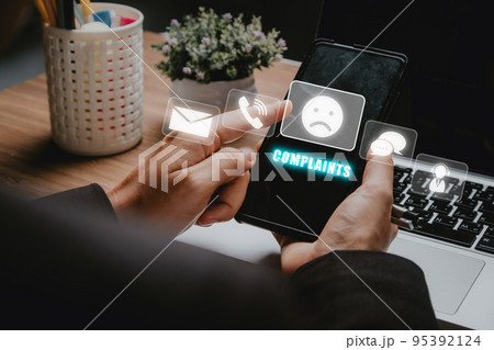 Complaints concept, Business woman using smartphone with complaints icon on vr screen, dissatisfaction from product or service problem, angry feedback from client. Complaints concept, Business woman using smartphone with complaints icon on vr screen, dissatisfaction from product or service problem, angry feedback from client. 95392124