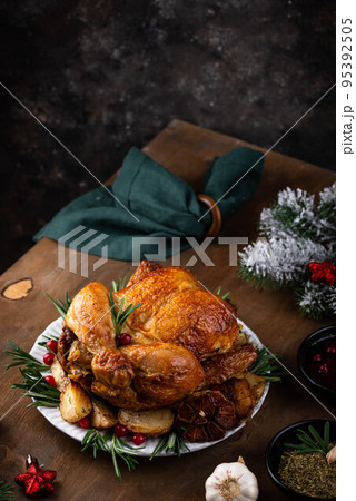 Christmas baked chicken for festive dinner. 95392505