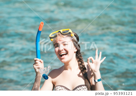 young woman enjoying diving at the Red Sea 95393121