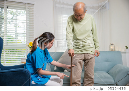 Asian doctor asking and explanation elderly man about pain symptom with walking stick Asian doctor asking and explanation elderly man about pain symptom with walking stick 95394436
