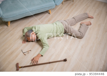 Sick senior old man falling down lying on floor because stumbled at home Sick senior old man falling down lying on floor because stumbled at home 95394446