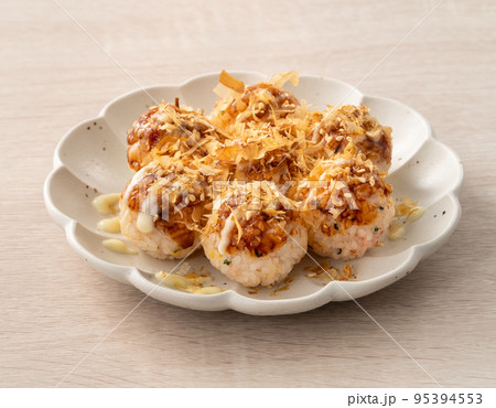 Homemade rice ball in takoyaki style on wooden table background. Homemade rice ball in takoyaki style on wooden table background. 95394553