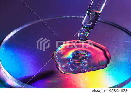 Pipette with sample of cosmetic product in petri dish on holographic background, iridescent highlights, selective focus Pipette with sample of cosmetic product in petri dish on holographic background, iridescent highlights, selective focus 95394823