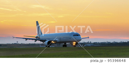 Passenger plane taxies onto the runway Passenger plane taxies onto the runway 95396648