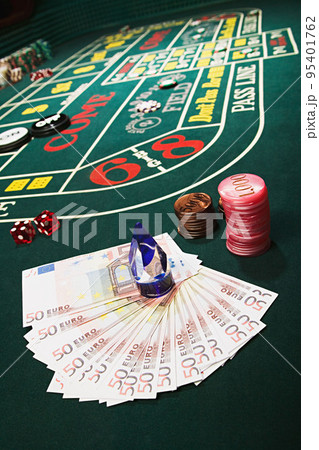 Money and chips on a craps table Money and chips on a craps table 95401762