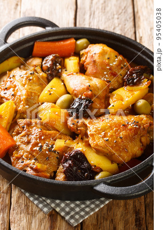 Gallo en chicha is a traditional chicken dish that is popular in El Salvador, as well as in other Central American countries closeup on the pan. Vertical Gallo en chicha is a traditional chicken dish that is popular in El Salvador, as well as in other Central American countries closeup on the pan. Vertical 95405038