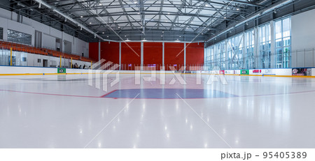 Riga, Latvia. July 10, 2022. Empty hockey rink sport arena ice and light 95405389
