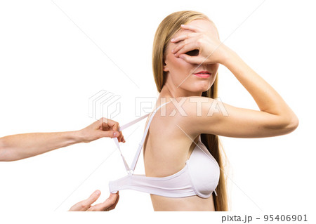 Woman wearing too big bra 95406901