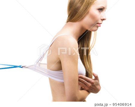 Woman wearing too big bra, loose band Woman wearing too big bra, loose band 95406914