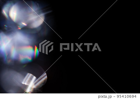 colorful rainbow crystal light leaks on black background 95410694