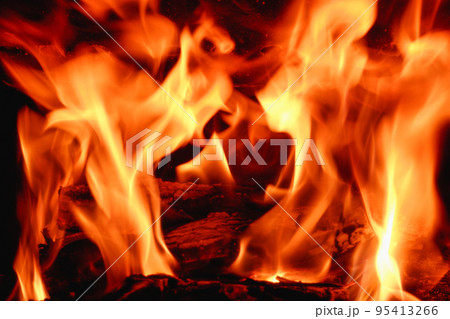 Fire in the fireplace close-up on a long exposure. Background. 95413266