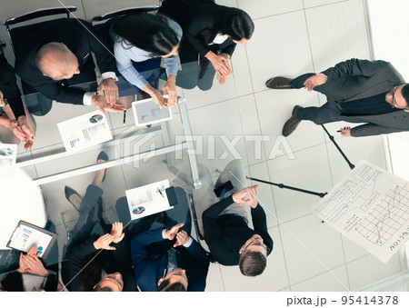 top view. business team applauding the speaker after the business presentation top view. business team applauding the speaker after the business presentation 95414378