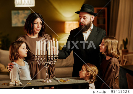 Jewish Family Lighting Menorah Candle 95415528