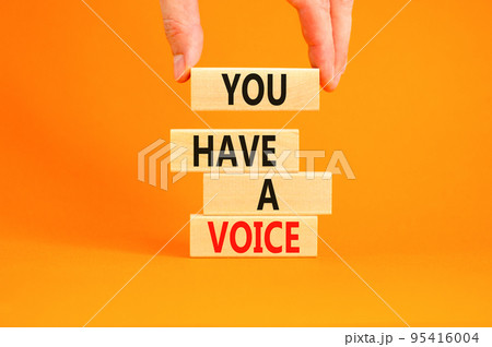 You have a voice symbol. Concept words You have a voice on wooden blocks. Beautiful orange table orange background. Businessman hand. Business, psychological you have a voice concept. Copy space. You have a voice symbol. Concept words You have a voice on wooden blocks. Beautiful orange table orange background. Businessman hand. Business, psychological you have a voice concept. Copy space. 95416004