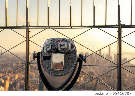 Tourist binoculars on the observation deck of a skyscraper in the center of New York Tourist binoculars on the observation deck of a skyscraper in the center of New York 95416707