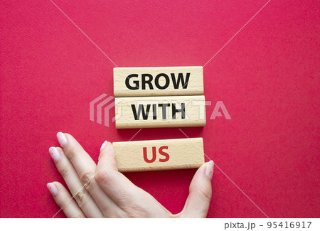 Grow with us symbol. Wooden blocks with words Grow with us. Beautiful red background. Businessman hand. Business and Grow with us concept. Copy space. Grow with us symbol. Wooden blocks with words Grow with us. Beautiful red background. Businessman hand. Business and Grow with us concept. Copy space. 95416917