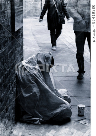 Alone, begging for help on a cold day. 95419580