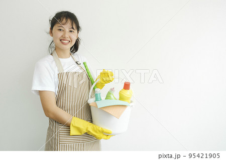 Young woman holding cleaning equipments ready for cleaning. 95421905