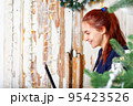 Happy caucasian youn woman portrait. Using laptop. 95423526