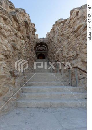 Mount Herodion and the ruins of the fortress of King Herod inside an artificial crater. The Judaean Desert, West Bank. 95424462