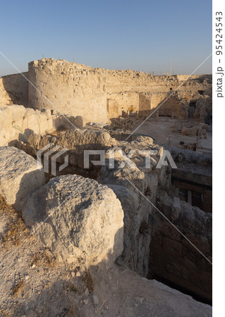 Mount Herodion and the ruins of the fortress of King Herod inside an artificial crater. The Judaean Desert, West Bank. 95424543