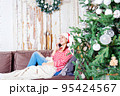 Young caucasian woman talking phone. Christmas time. 95424567