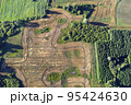 Crop fields, sinkholes and groves in nature park, aerial view 95424630