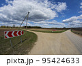 Crossroads two gravel roads and road sign 95424633